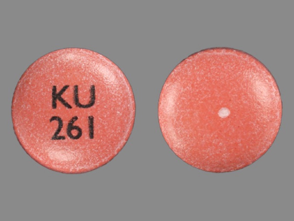 Pill with imprint KU 261, pink, round, 10 mm (Nifedipine 60 mg)