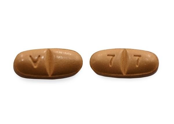 Pill with imprint V 7 7, brown, oval, 5 mm (Oxcarbazepine 300 mg)