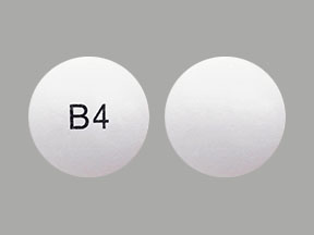 Pill with imprint B4, white, round, 10 mm (Chlorpromazine Hydrochloride 100 mg)