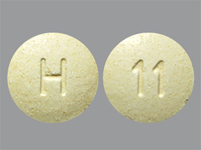 Pill with imprint H 11, yellow, round, 6 mm (Repaglinide 1 mg)