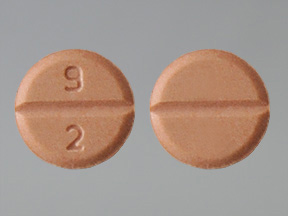 Pill with imprint 9 2, yellow, round, 6 mm (Pramipexole Dihydrochloride 0.25 mg)