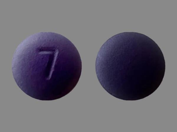 Pill with imprint 7, purple, round, 8 mm (Hydroxyzine Hydrochloride 50 mg)