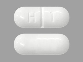 Pill with imprint H 1, white, capsule, 20 mm (Methenamine Hippurate 1000 mg)